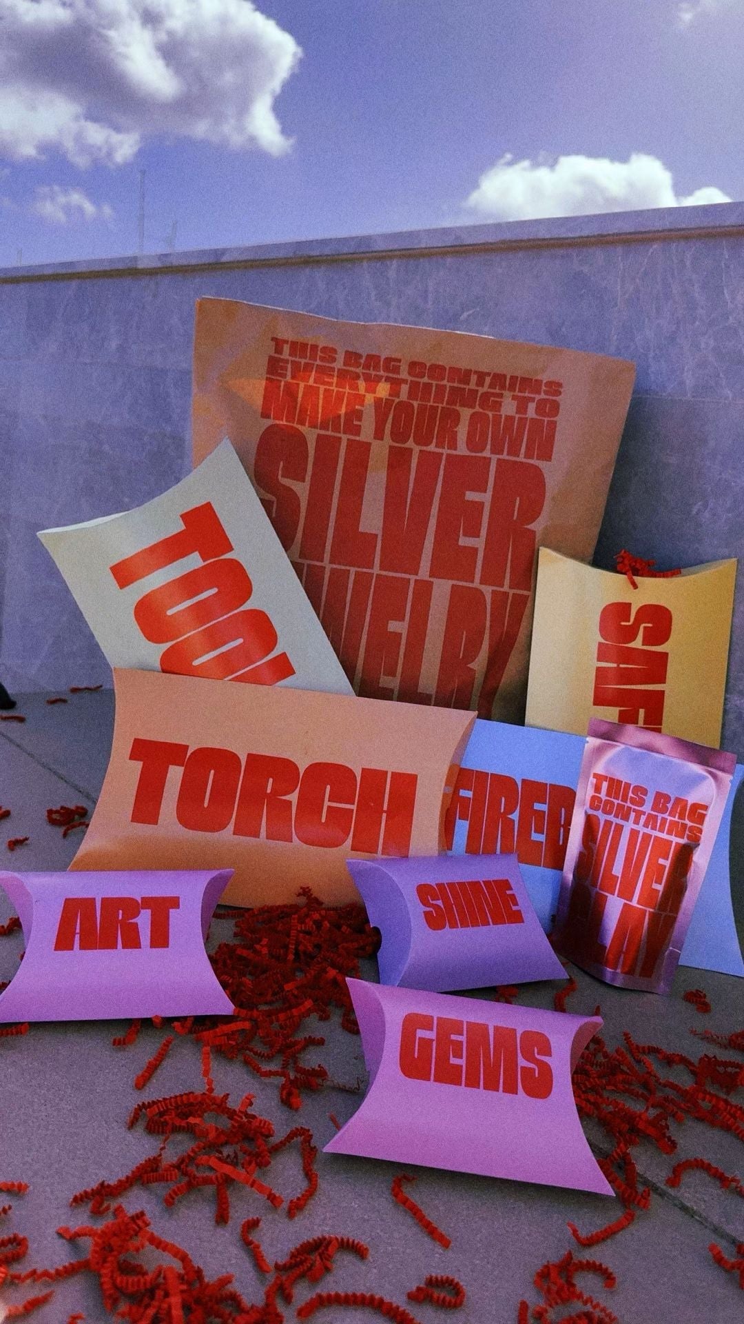 Silver clay starter kit packaging with labelled paper pouches for tools, gems and torch