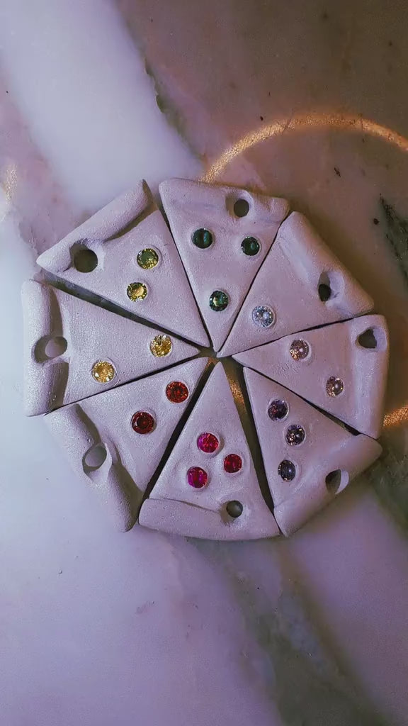 Silver clay pizza slices with colorful gemstones made using pizza wheel cutter tool